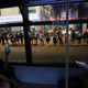 Demonstrators, seen from inside a tram, link hands along a street in Hong Kong.